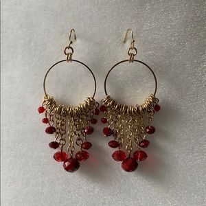 Gold statement earrings with red beads